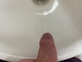 Guy pees uncut dick in sink