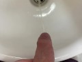Guy pees uncut dick in sink