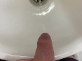 Guy pees uncut dick in sink