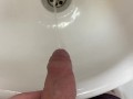 Guy pees uncut dick in sink