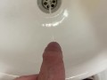 Guy pees uncut dick in sink
