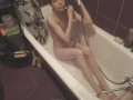 A slender brunette washes herself in the bath and gives a blowjob - PlayingGods