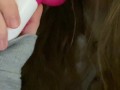 Young pretty brunette sucking her pink toy