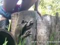 Girl uses a log as a toilet to pee
