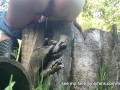 Girl uses a log as a toilet to pee