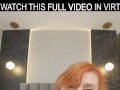 Hot redhead Lola Red plays with a huge dildo on the bed in VR.