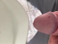 Peeing in a urinal very close up