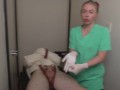 Gloved Nurse Semen Extraction on Restrained Patient