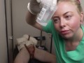 Gloved Nurse Semen Extraction on Restrained Patient