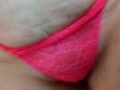 Smoking in neon pink lace bra and panties