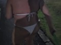 Bikini wearing BBW MILF walking and stripping