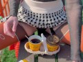 Naked drinking coffee in the park