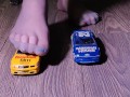 Crushing miniature model cars covered in baby oil wearing my nylon stockings