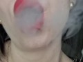 Smoking with bare tits, red lips