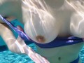 Hot teen flashes her nice tits in a public pool