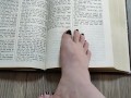 Using my long finger toes to flip through the pages of a Bible with my clean barefeet
