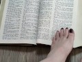 Using my long finger toes to flip through the pages of a Bible with my clean barefeet