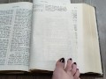Using my long finger toes to flip through the pages of a Bible with my clean barefeet