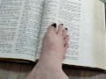 Using my long finger toes to flip through the pages of a Bible with my clean barefeet