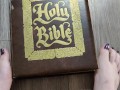 Using my long finger toes to flip through the pages of a Bible with my clean barefeet