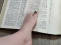 Using my long finger toes to flip through the pages of a Bible with my clean barefeet