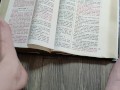 Using my long finger toes to flip through the pages of a Bible with my clean barefeet