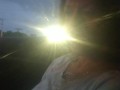 Milf smoking cigarettes while in passenger seat in vehicle