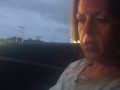 Milf smoking cigarettes while in passenger seat in vehicle