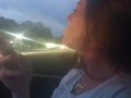 Milf smoking cigarettes while in passenger seat in vehicle