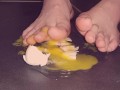 Egg gets crushed by barefeet Giantess