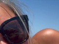 15 milf Sneaky side HJ on public beach