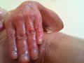 Oiling body, playing with nipples and oily pussy close up view