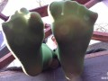 My nylon feet in green tights on your face