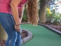 Pretty girl golfing and she completely miss the shot
