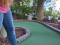 Pretty girl golfing and she completely miss the shot