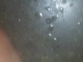 Hot guy squirts a huge cum load in public adult glory hole while people watch through the holes