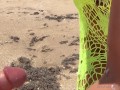 23 asian wife gives handjob on the beach in fishnet dress