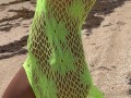 23 asian wife gives handjob on the beach in fishnet dress
