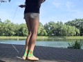 Girl jumping rope in nature