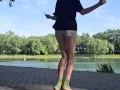 Girl jumping rope in nature