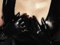 Blond Girl in Latex Dress gives Handjob in her Latex Gloves till Cum