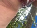 Peeing in the woods close-up