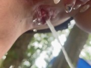 Peeing in the woods close-up