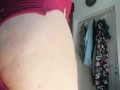 Sexy wife has fun trying on clothes and cutting them. Brunette dances naked around the house.