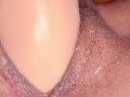Mature woman masturbates with a vibrator to orgasm.