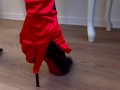 A girl wearing nude stockings and red gloves