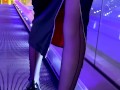 A girl wearing black nylons stockings and high heels