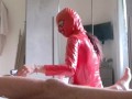 The milf in a latex suit sucks cock with cum in her mouth