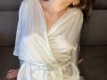 Hot wife in a dressing gown waits for her pussy lover while she's home alone
