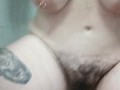 Hairy pussy, big boobs peeing in a public toilet